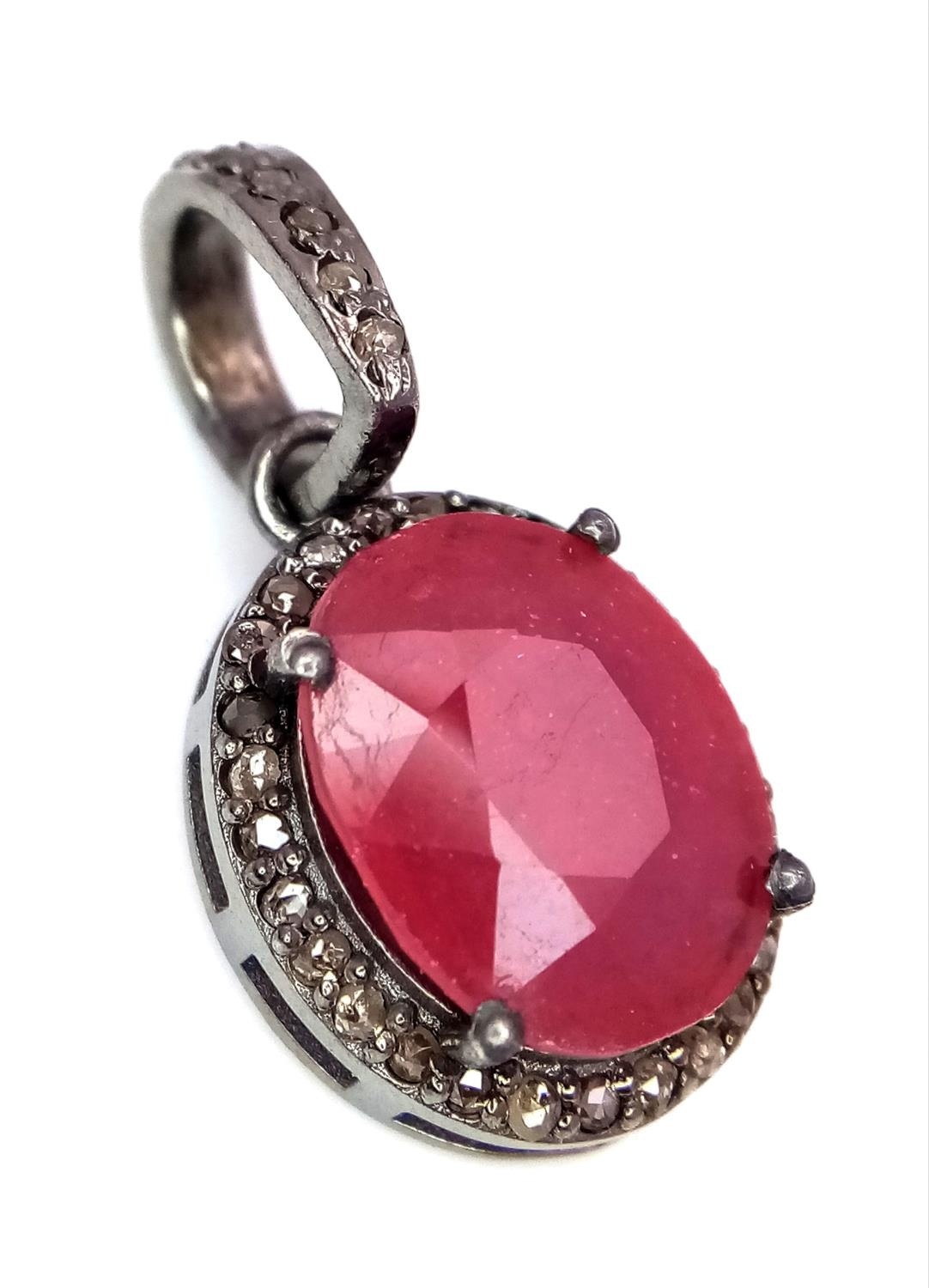 A Ruby and Rose Cut Diamond Pendant. Oval cut. Set in 925 Sterling Silver. 4.90ct ruby. Diamonds -