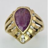 A Vintage 14K Yellow Gold Amethyst and Diamond Ring. Teardrop central amethyst with a diamond