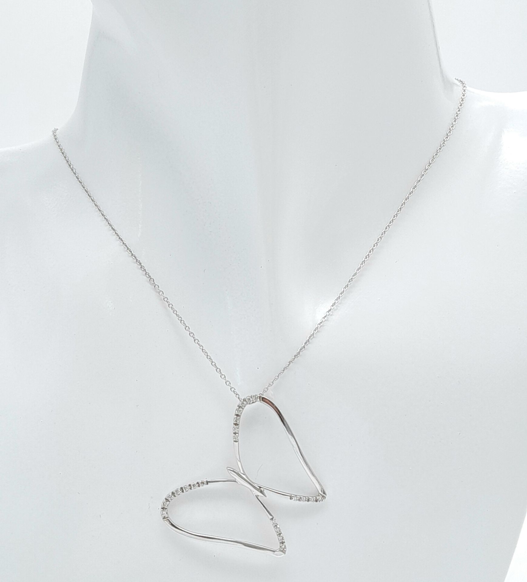 A 18ct White Gold Diamond Butterfly Necklace, 0.08ct diamond, 16” length, 4.6g weight, approx 32mm x