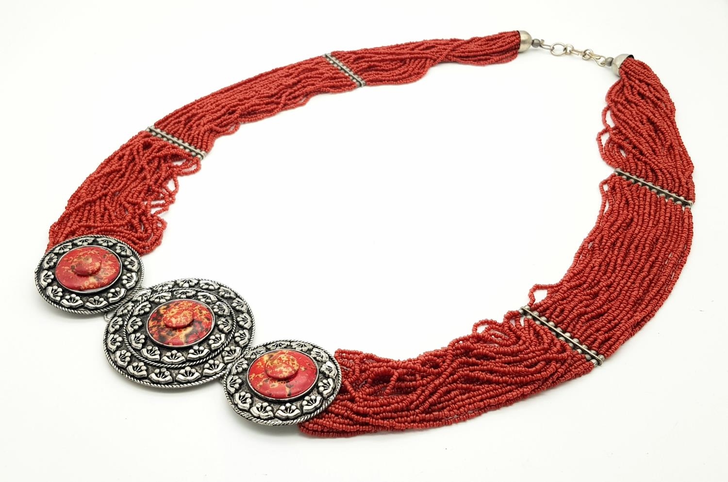 A Statement Multi-Strand Coral Necklace with a Trio of Discs. 1m length, 241.20g total weight.