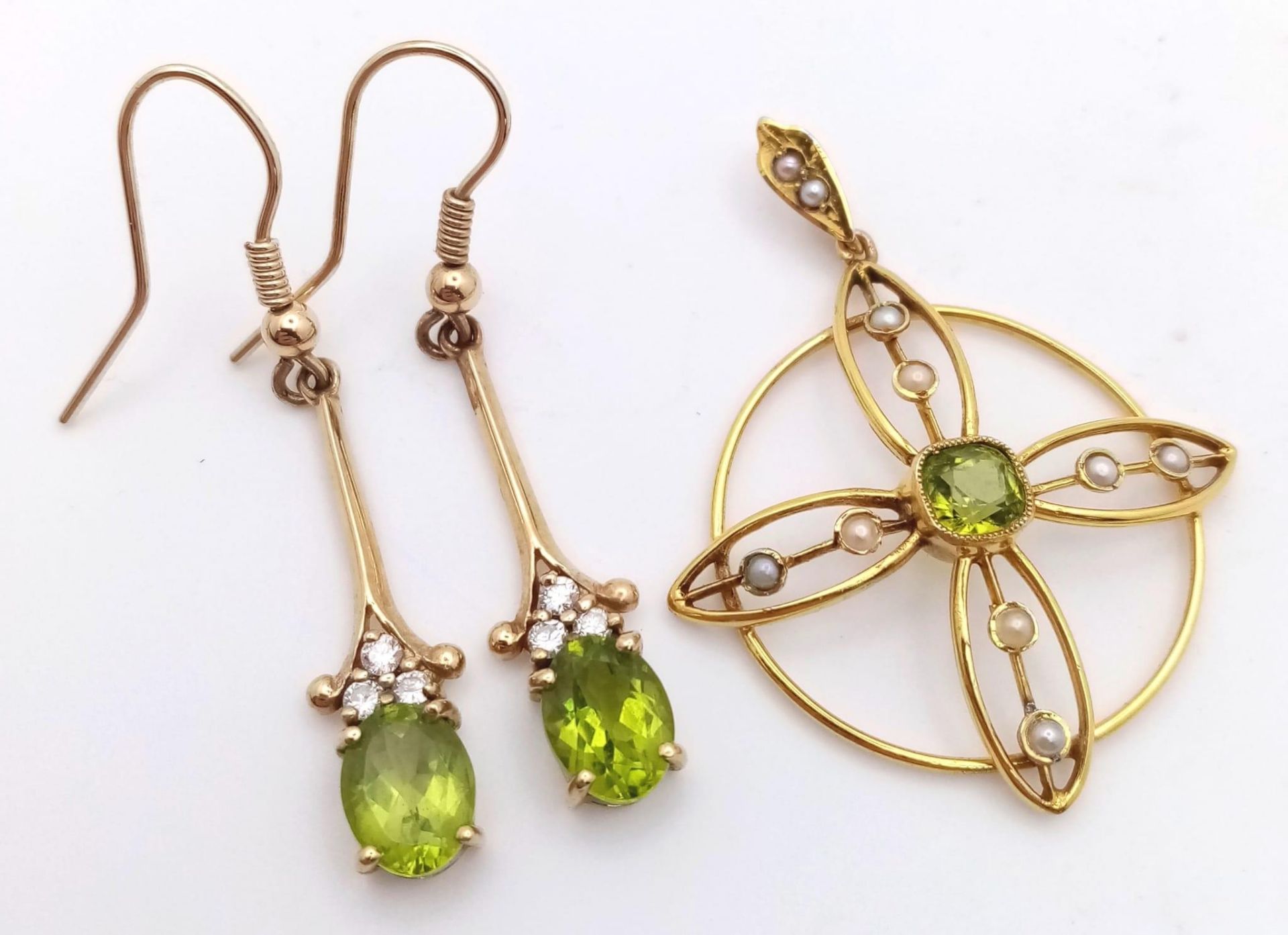 A 9K Yellow Gold, Peridot Drop Earring and Pendant Set. Both decorated with seed pearls. Pendant -