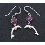 A Pair of Sterling Silver Ruby Set Dolphin Pendant Earrings. 2.5cm Drop. Set with 5mm Round Cut Ruby