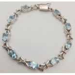 A Blue Topaz Tennis Bracelet. Set in 925 Sterling Silver. 28ctw. W-17.60g. 18cm. HV -2169.