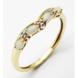 A 9K (TESTED AS) YELLOW GOLD DIAMOND & OPAL RING 1.8G SIZE U. SC 9022