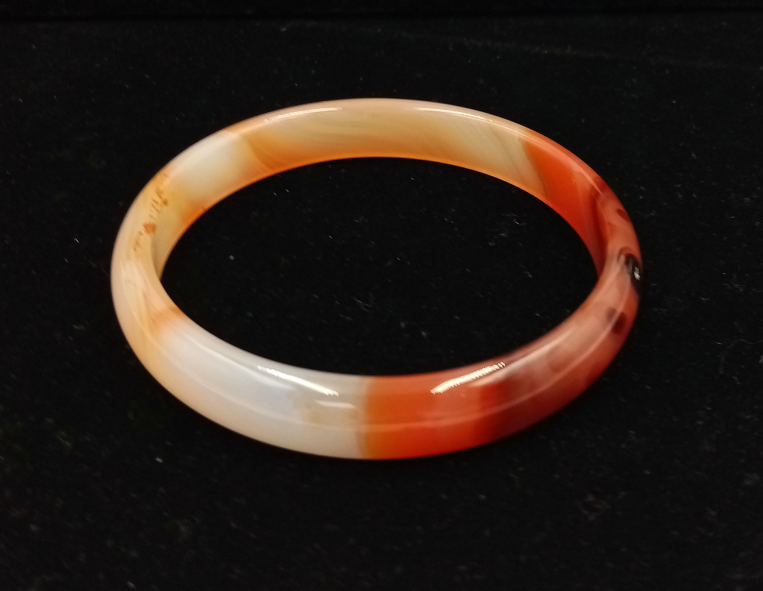 A Multi-Coloured Thin Jade Bangle. 6cm inner diameter.