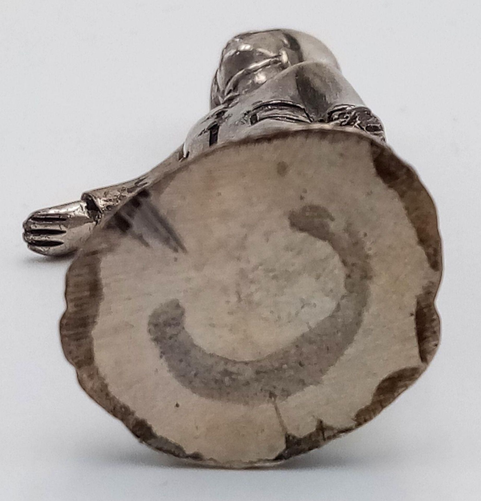 A STERLING SILVER (TESTED AS) FIGURE OF A YOUNG BOY IN RAIN JACKET AND HAT WITH A BOAT POSSIBLY - Image 4 of 5