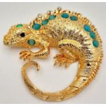 A very glamorous, well proportioned, gold plated and gem studded chameleon brooch, in a presentation