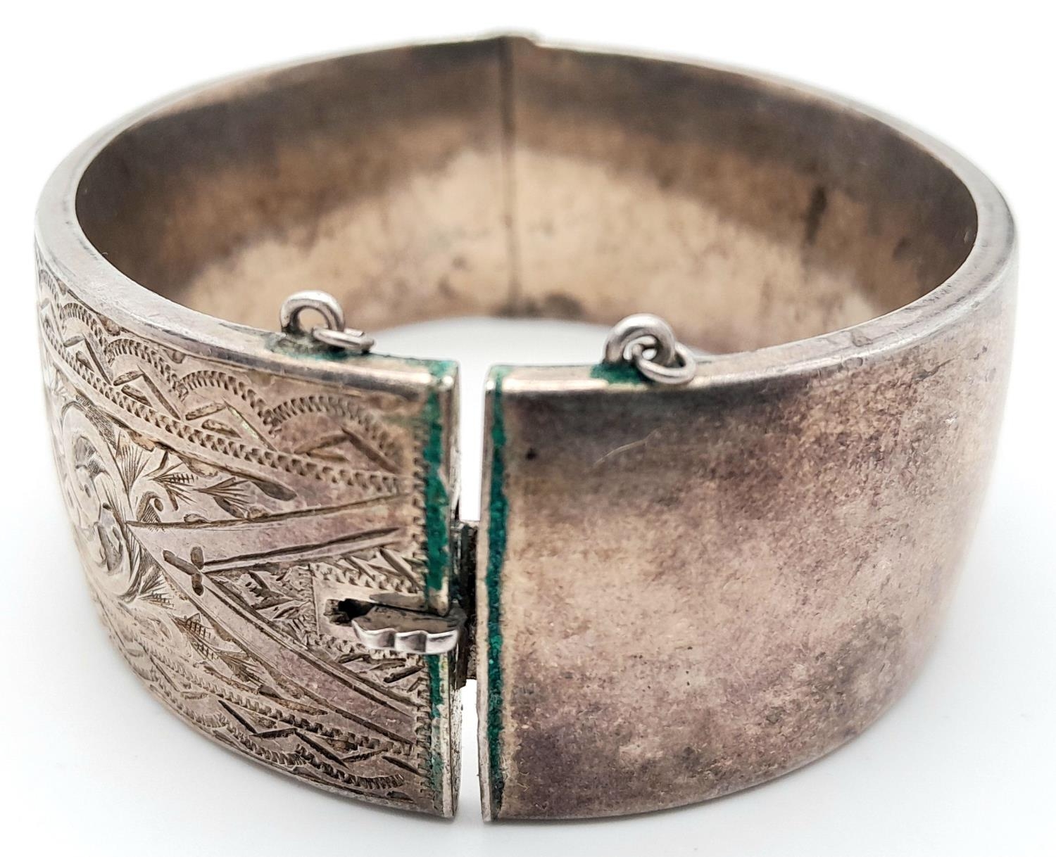 A Silver Victorian Engraved Bangle. 6.3cm diameter, 3cm band width, 43.69g weight. - Image 3 of 8
