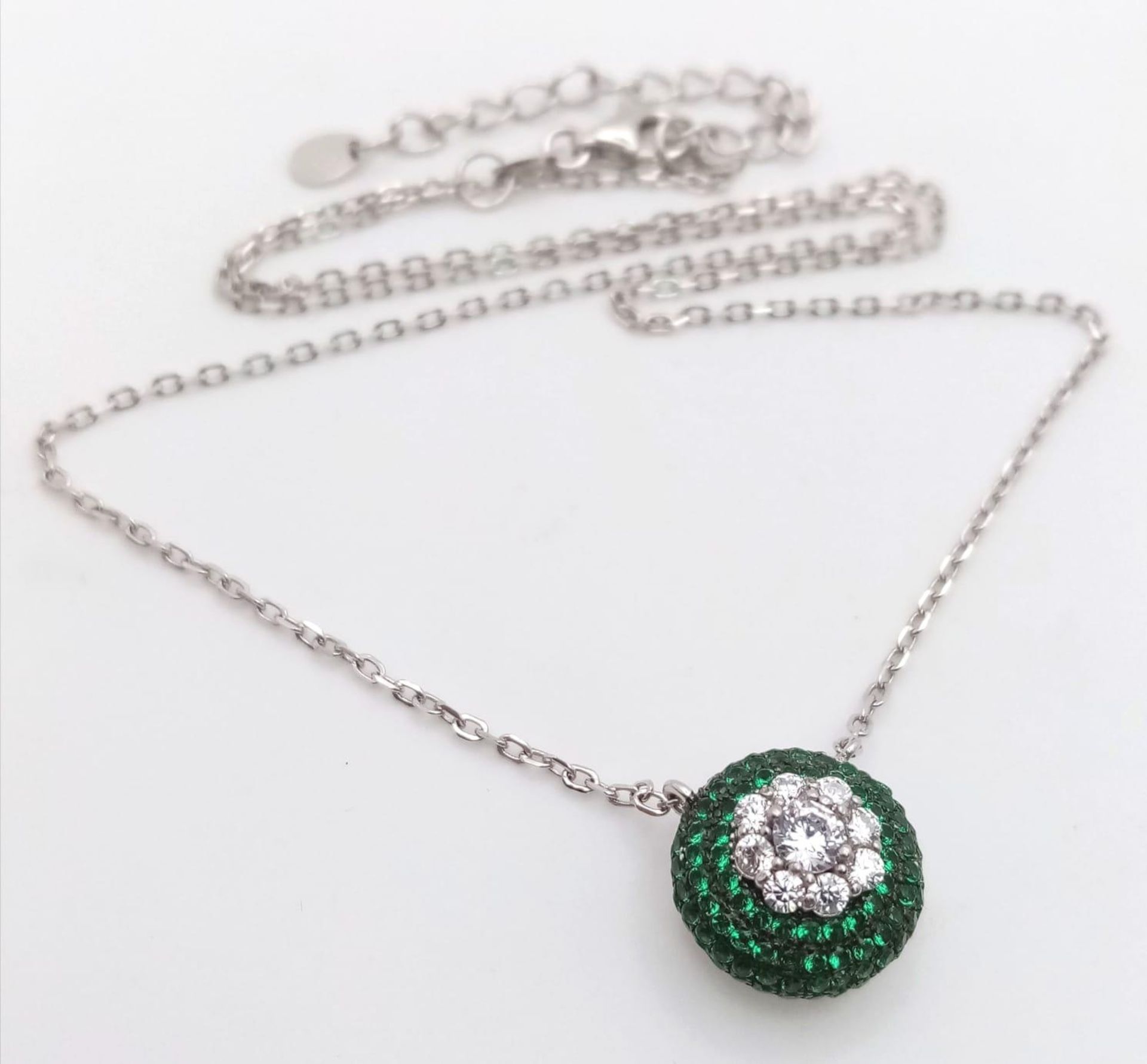A 925 Silver, Green and White Stone Pendant on a 925 Silver Disappearing Necklace.