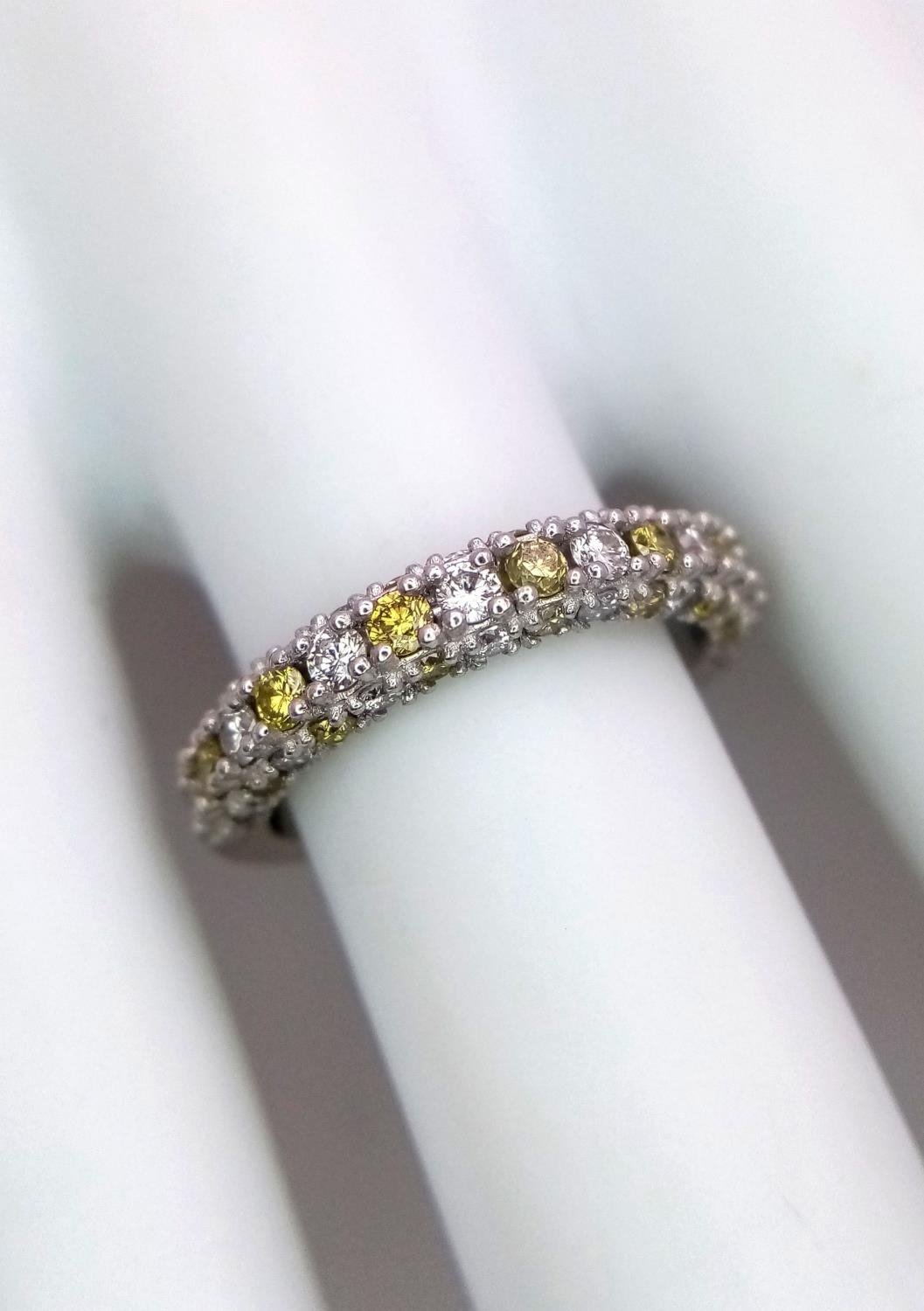 A Platinum White and Yellow Diamond Three-Sided Half Eternity Ring. Size L. 6.3g total weight. - Image 9 of 9