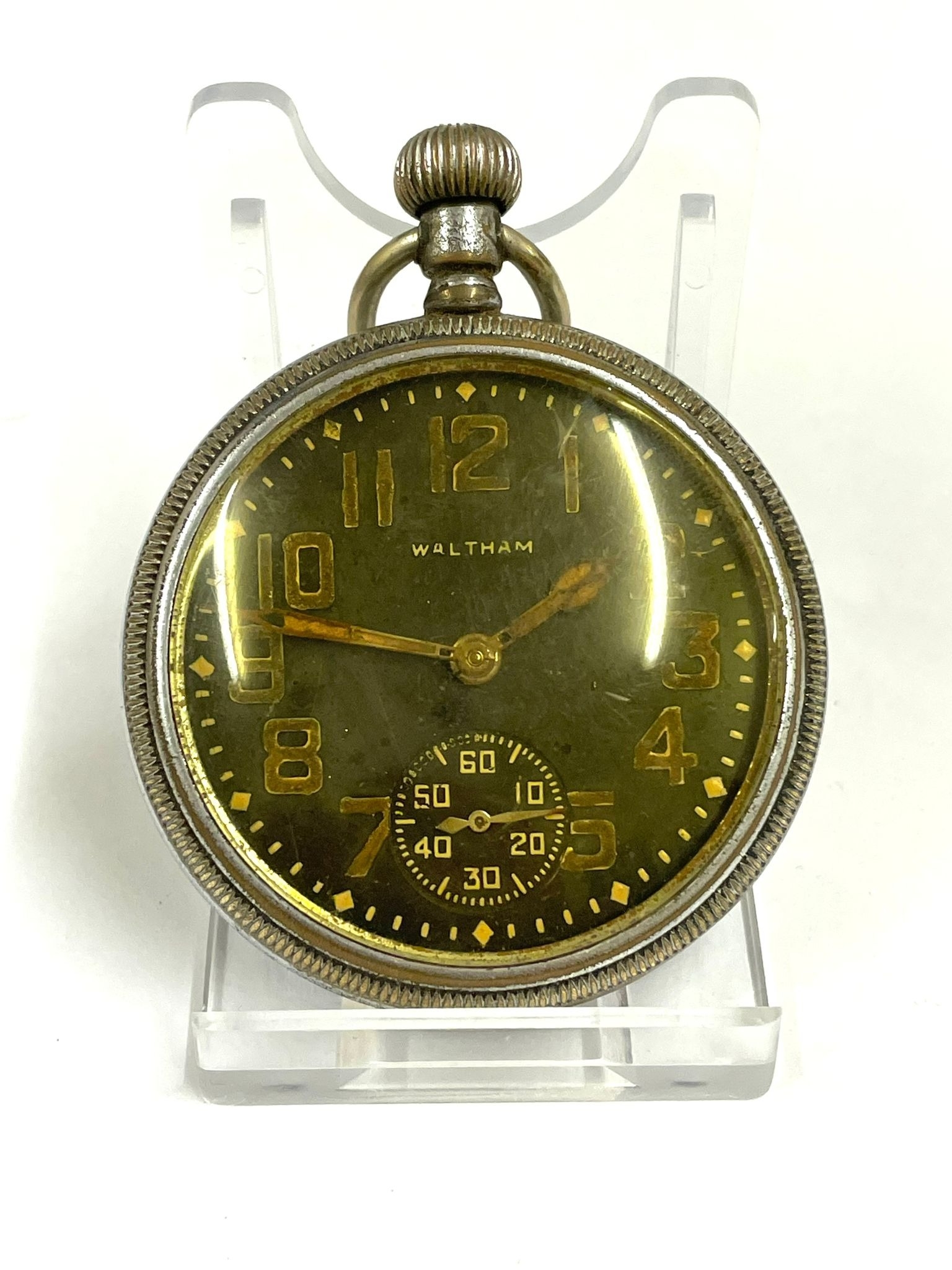 A Vintage military broad arrow Waltham pocket watch. In working order.