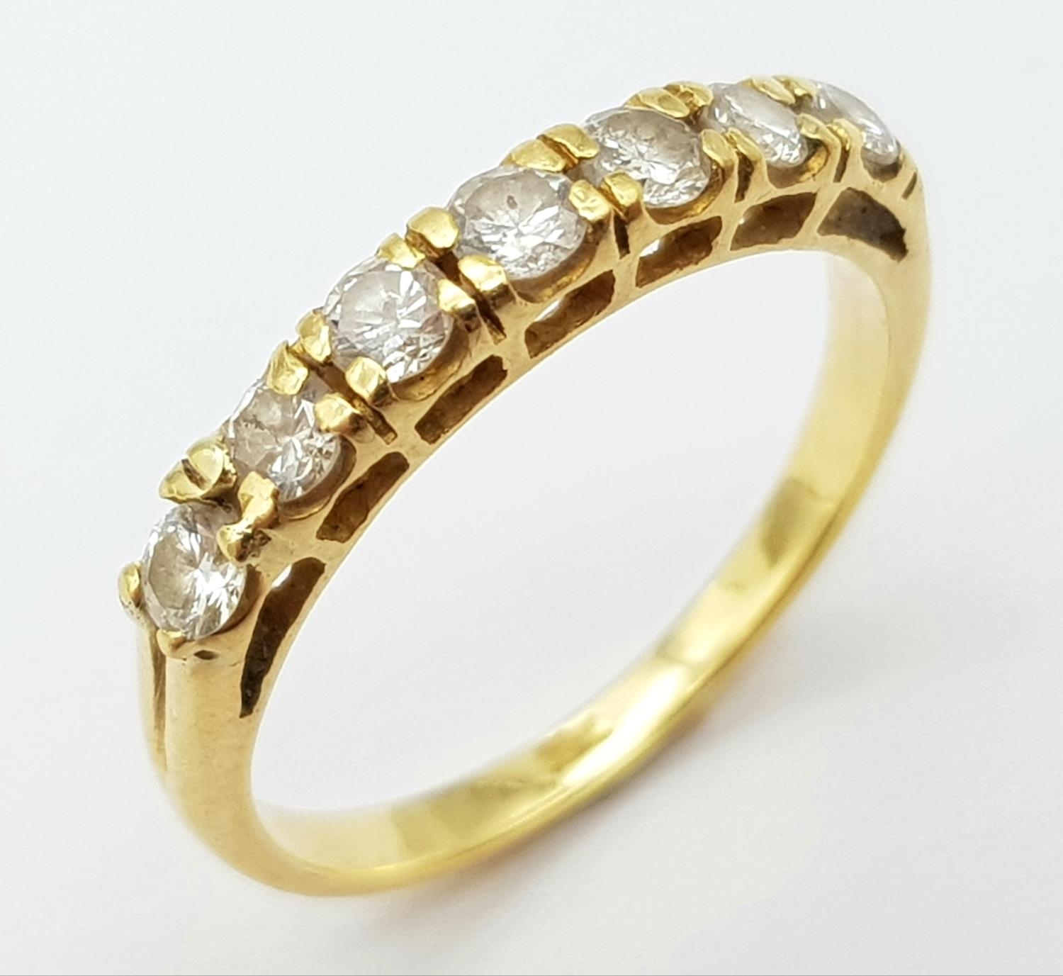 AN 18K (TESTED) YELLOW GOLD DIAMOND BAND RING. 0.35ctw, size I, 1.9g total weight. Ref: SC 9043