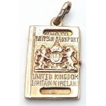 A 9K YELLOW GOLD DRIVING LICENCE CHARM, WHICH OPENS UP. 3cm length, 4.7g weight. Ref: SC 9057