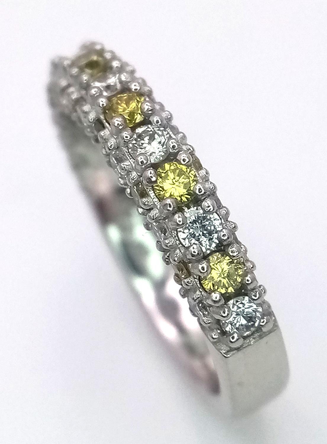 A Platinum White and Yellow Diamond Three-Sided Half Eternity Ring. Size L. 6.3g total weight. - Image 4 of 9