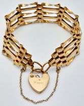 A Vintage 9K Yellow Gold Gate Bracelet with Heart Clasp. 16cm. 10.8g.