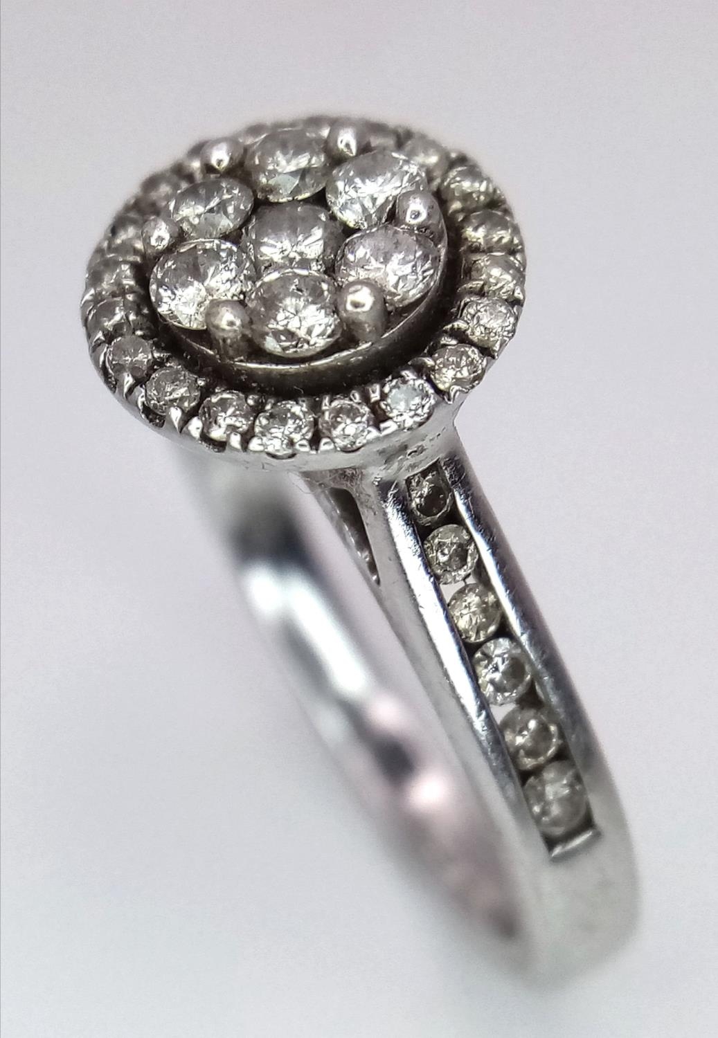 A 9K White Gold Diamond Cluster Ring. Decorative floral shape. Size N. 4g total weight. - Image 3 of 5