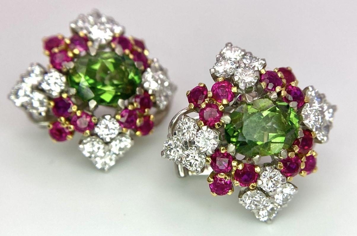 A Pair of Platinum, Emerald, Ruby and Diamond Earrings. Each earring containing a 1.5ct oval cut - Image 4 of 5