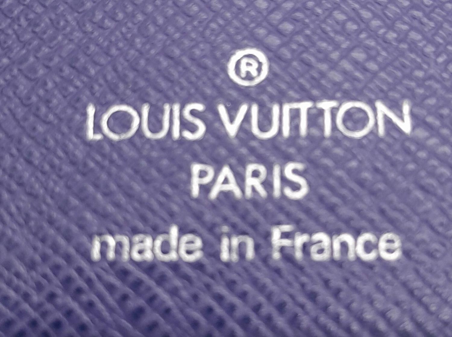 A Vintage Louis Vuitton Blue Bifold Wallet. Epi leather exterior with silver-toned hardware and - Image 8 of 17