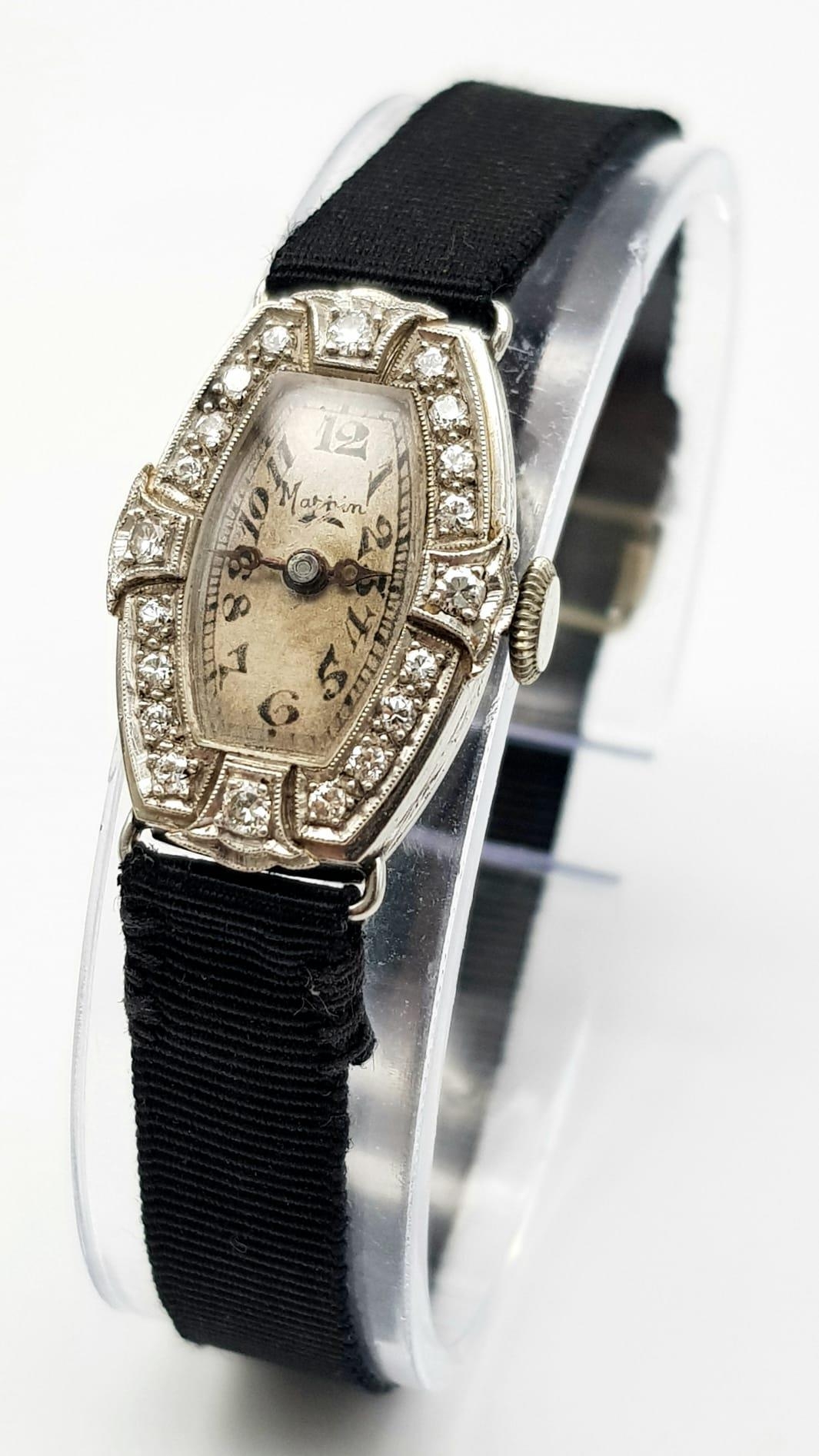 A 1920s Art Deco Mappin and Webb Platinum and Diamond Cocktail Ladies Watch. Original textile strap.