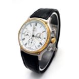 An Ebel Automatic Chronograph Gents Watch. Black leather strap. Two tone case - 38mm. White dial