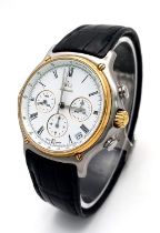An Ebel Automatic Chronograph Gents Watch. Black leather strap. Two tone case - 38mm. White dial
