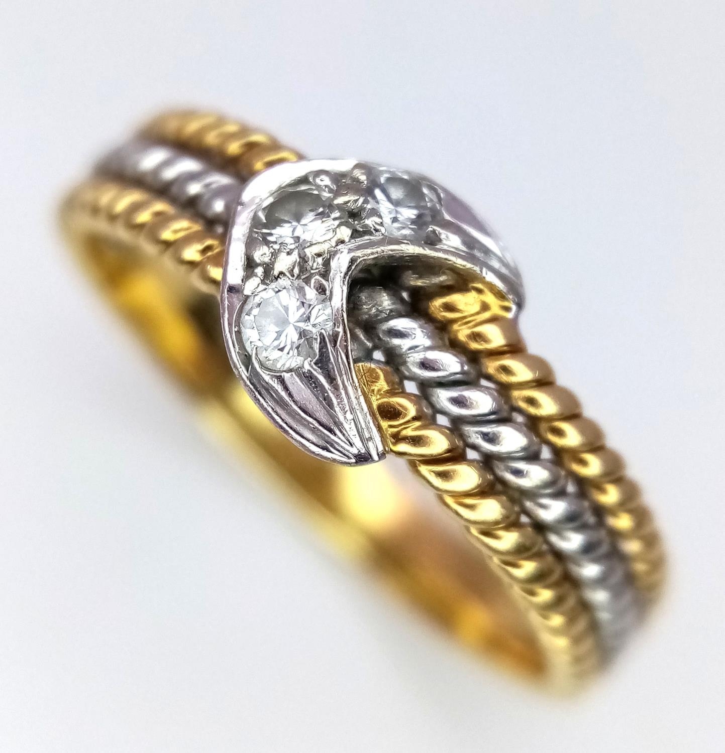An 18K White and Yellow Gold, Diamond Crescent Ring. Size K. 2.85g total weight.