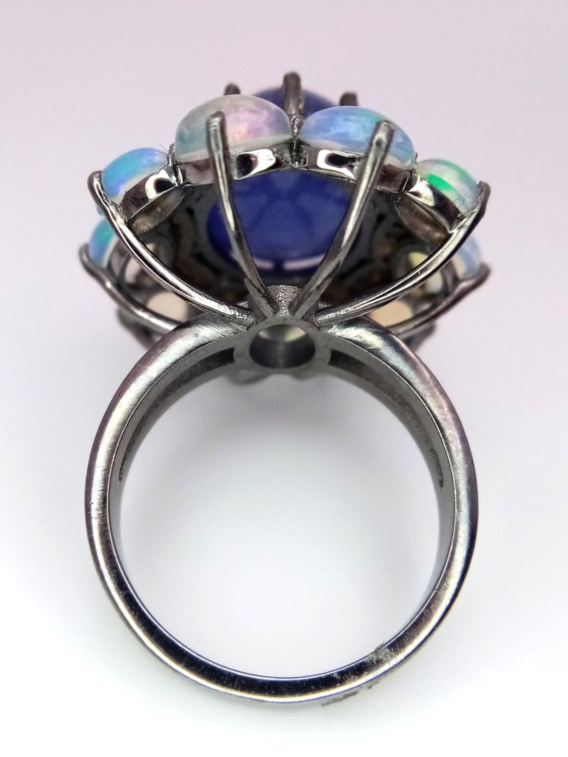 A 10ct Tanzanite Gemstone Dress Ring with 3ctw Opal Surround and 0.50ctw of Diamond Accents. Size N. - Image 4 of 5