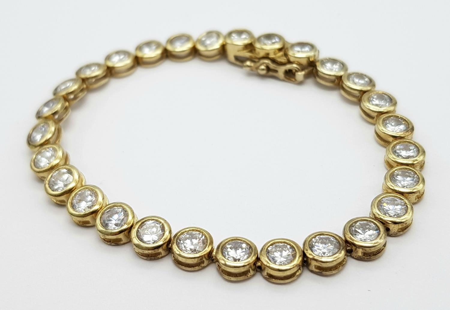 A Gilded 925 Silver Cubic Zirconia Bracelet. 18.5cm length, 16.4g total weight. - Image 2 of 5