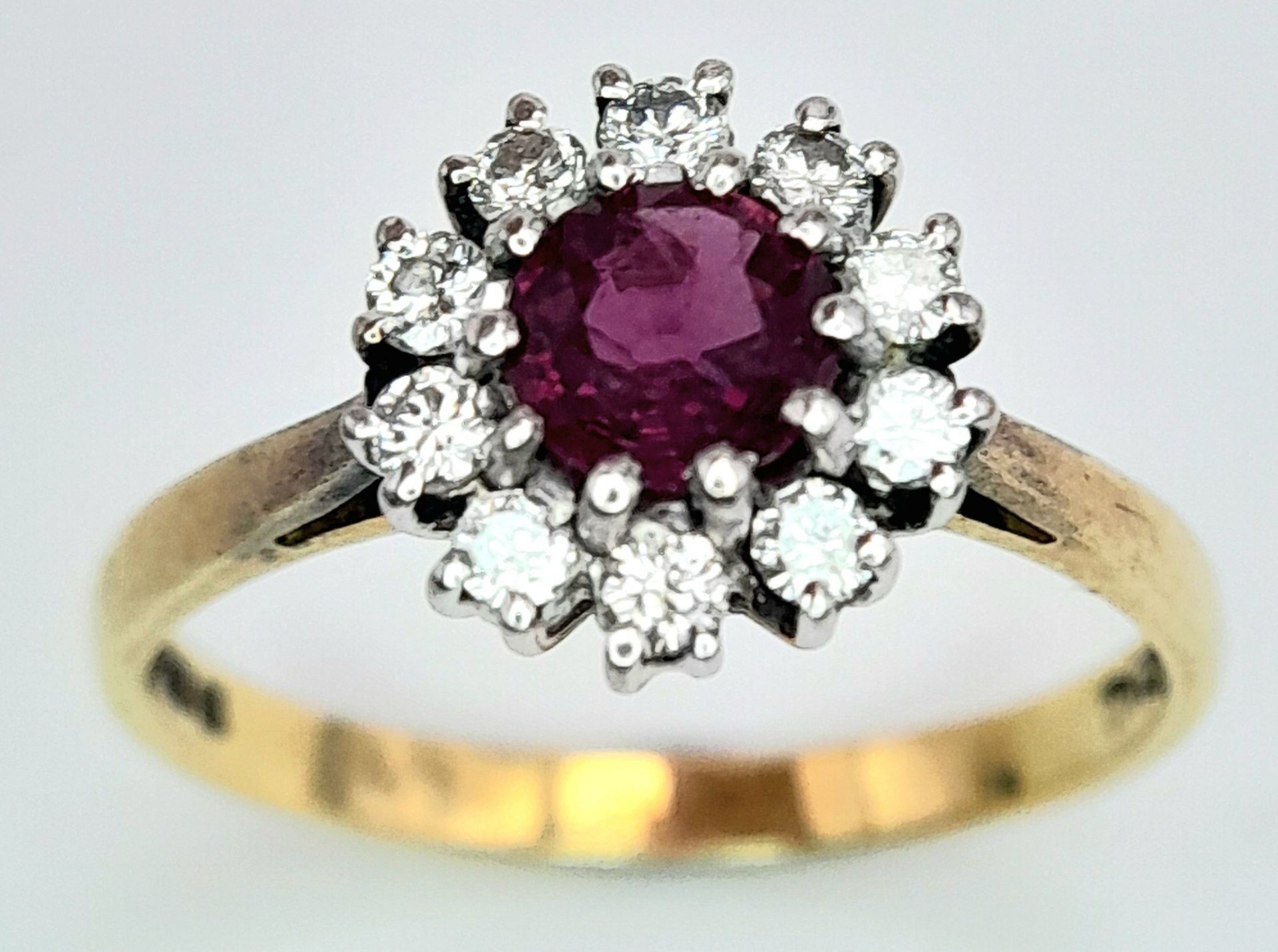 An 18K Yellow Gold, Ruby and Diamond Ring. Round cut ruby with a diamond halo. Size M 1/2. 2.8g - Image 2 of 8