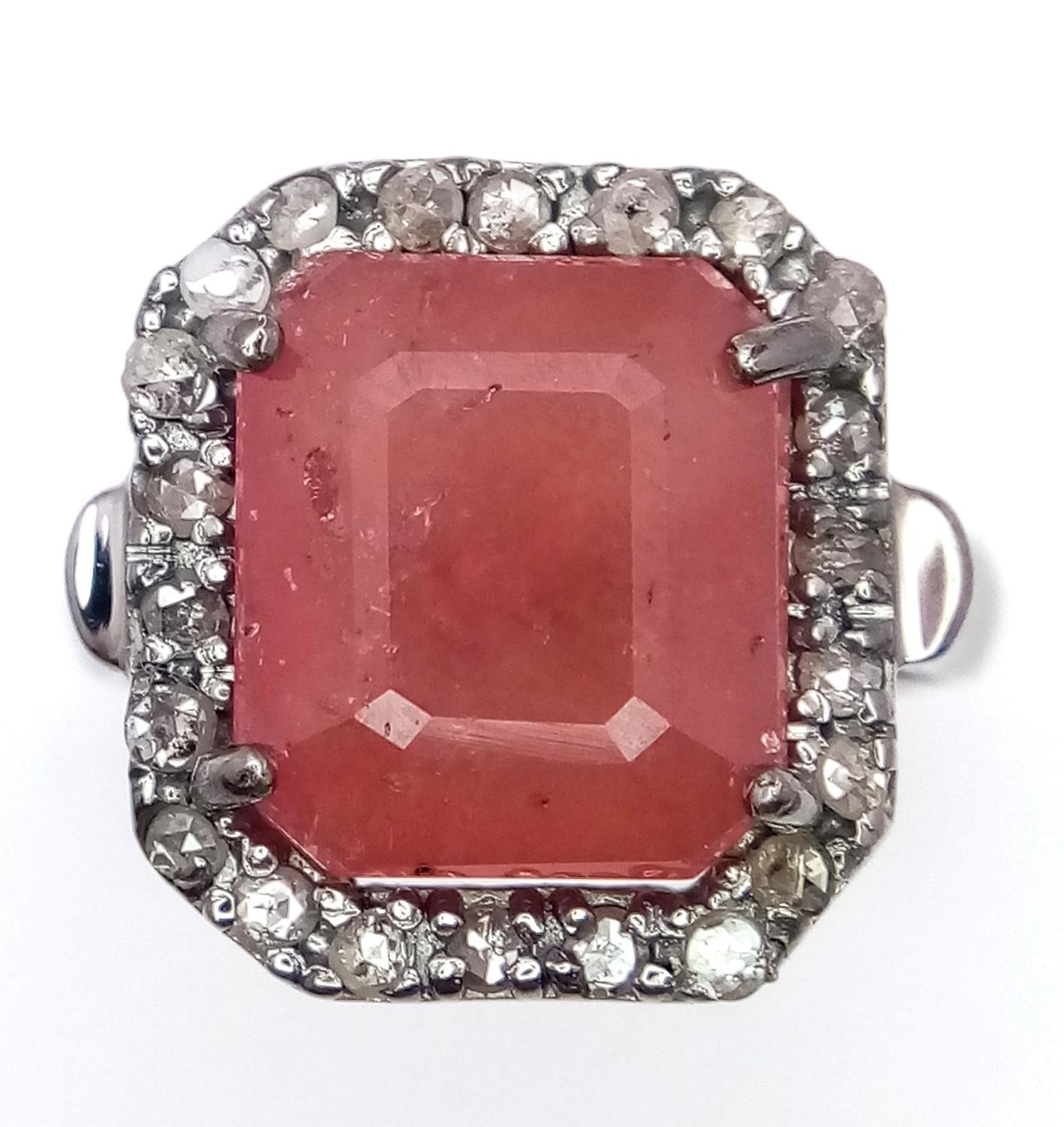 A Ruby Gemstone Ring with a Diamond Surround. 5.5ct ruby and diamonds - 0.55ctw. Set in 925