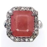 A Ruby Gemstone Ring with a Diamond Surround. 5.5ct ruby and diamonds - 0.55ctw. Set in 925