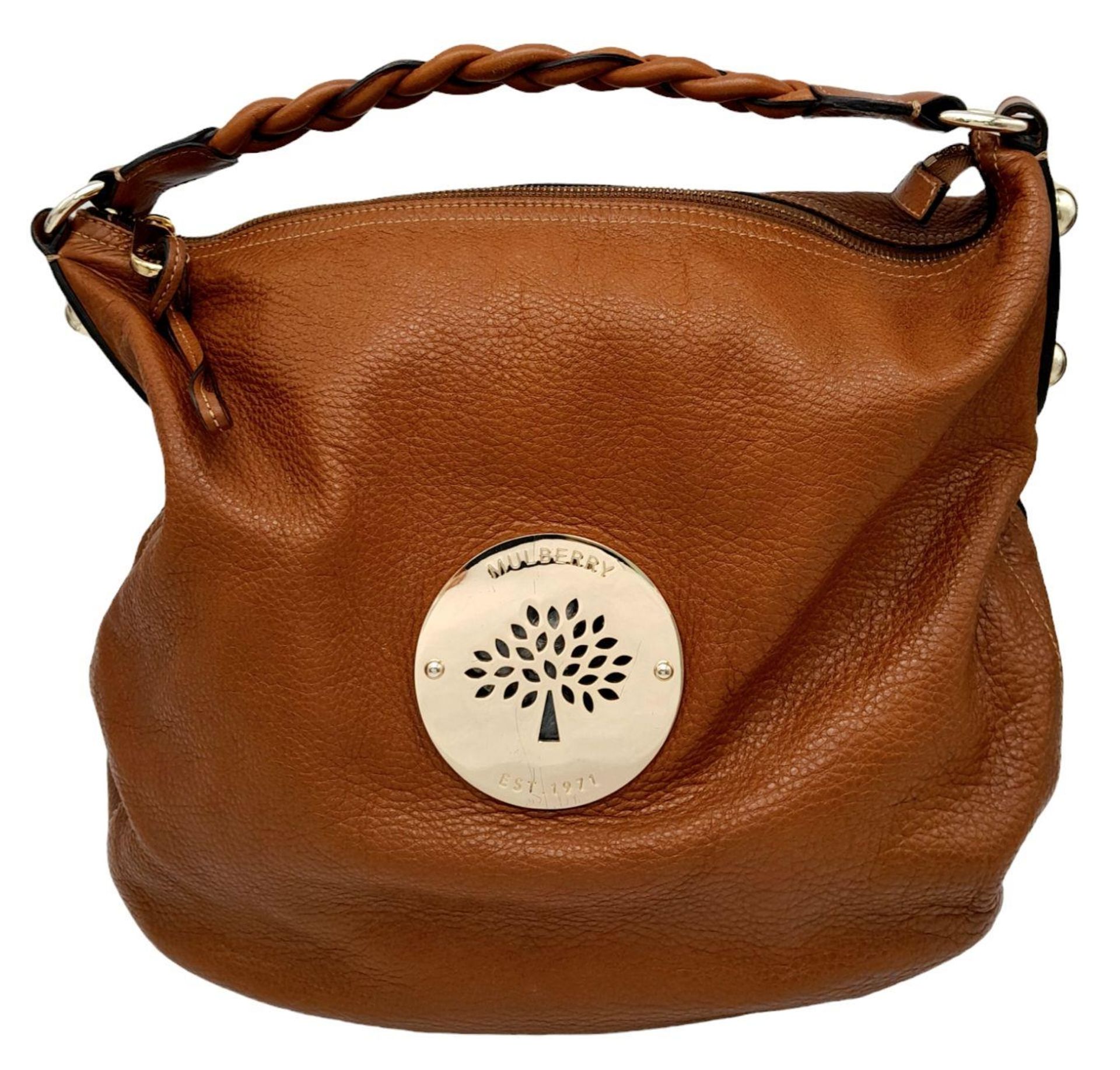 A Mulberry Tan Daria Hobo Bag. Leather exterior with gold-toned hardware, braided strap and zip