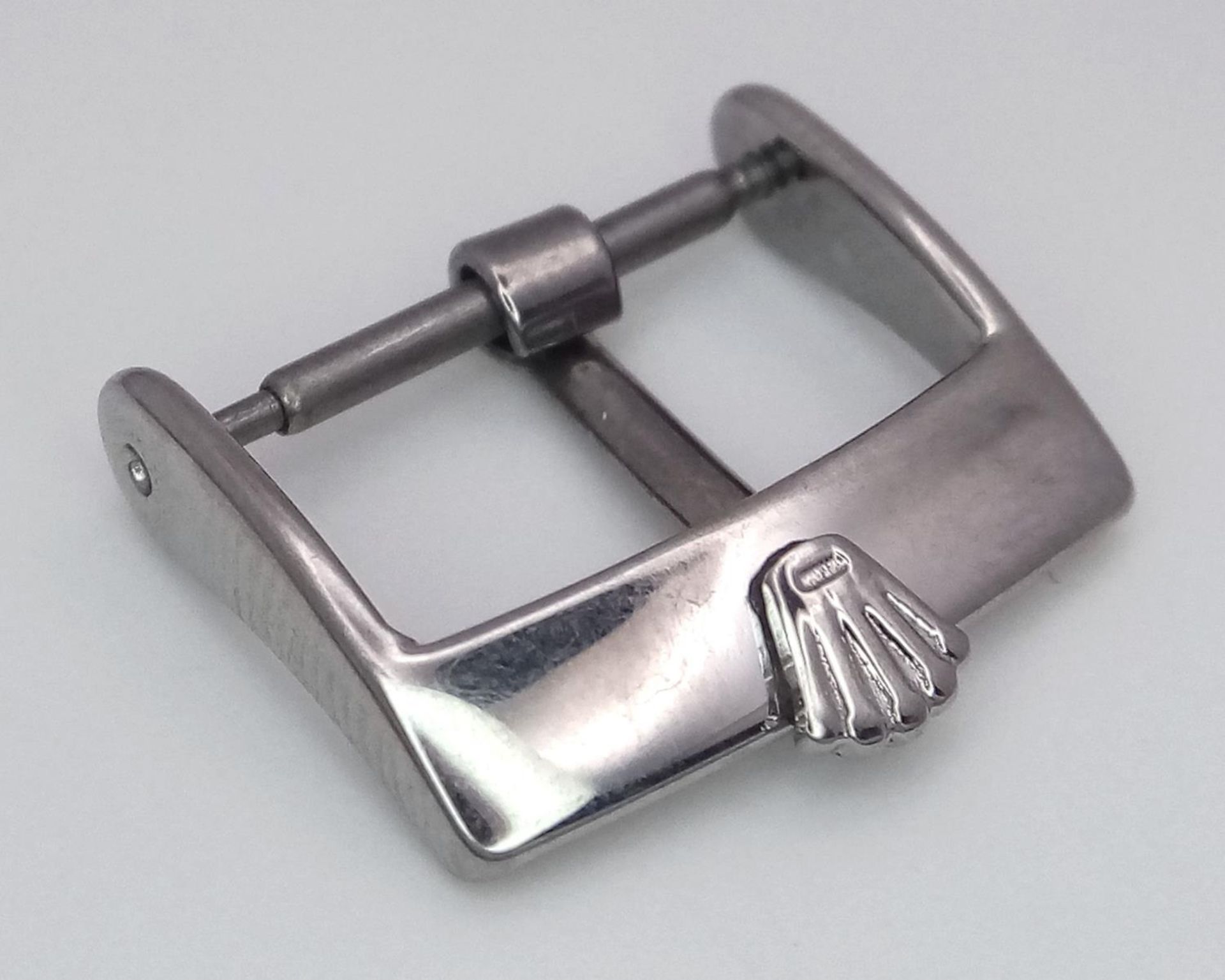 A Rolex Branded Watch Strap Buckle.