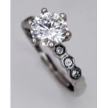 A 1ct Moissanite Ring set in 925 Silver. Comes with a GRA certificate. Size N.