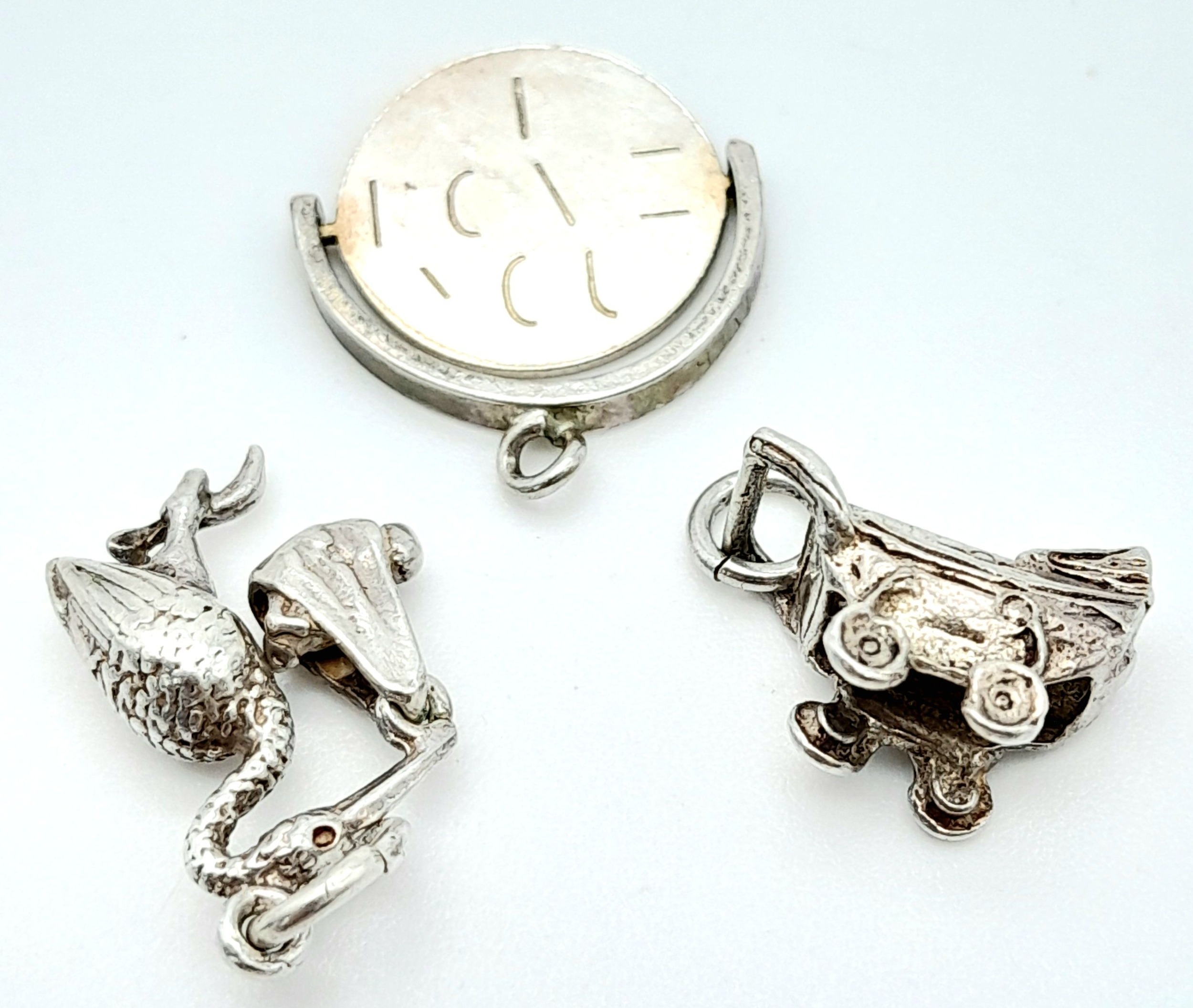 3 X STERLING SILVER NEW BABY THEMED CHARMS - PRAM, STALK CARRYING BABY, AND I LOVE YOU SPINNER. 4.4g - Image 2 of 3