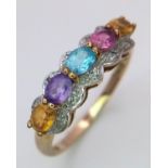 A 9ct yellow gold multi stone ring, featuring diamonds, amethyst, citrine and topaz, size P, 2g.