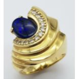 A Gorgeous 18K Yellow Gold (tested) Australian Black Opal and Diamond Ring. An enticing oval cut