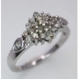 A 9K WHITE GOLD DIAMOND CLUSTER RING. 0.25ctw, size M, 2.7g total weight. Ref: SC 9026