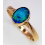 A 14K (TESTED) YELLOW GOLD DOUBLET OPAL RING. Size K, 1.4g total weight. Ref: SC 9033