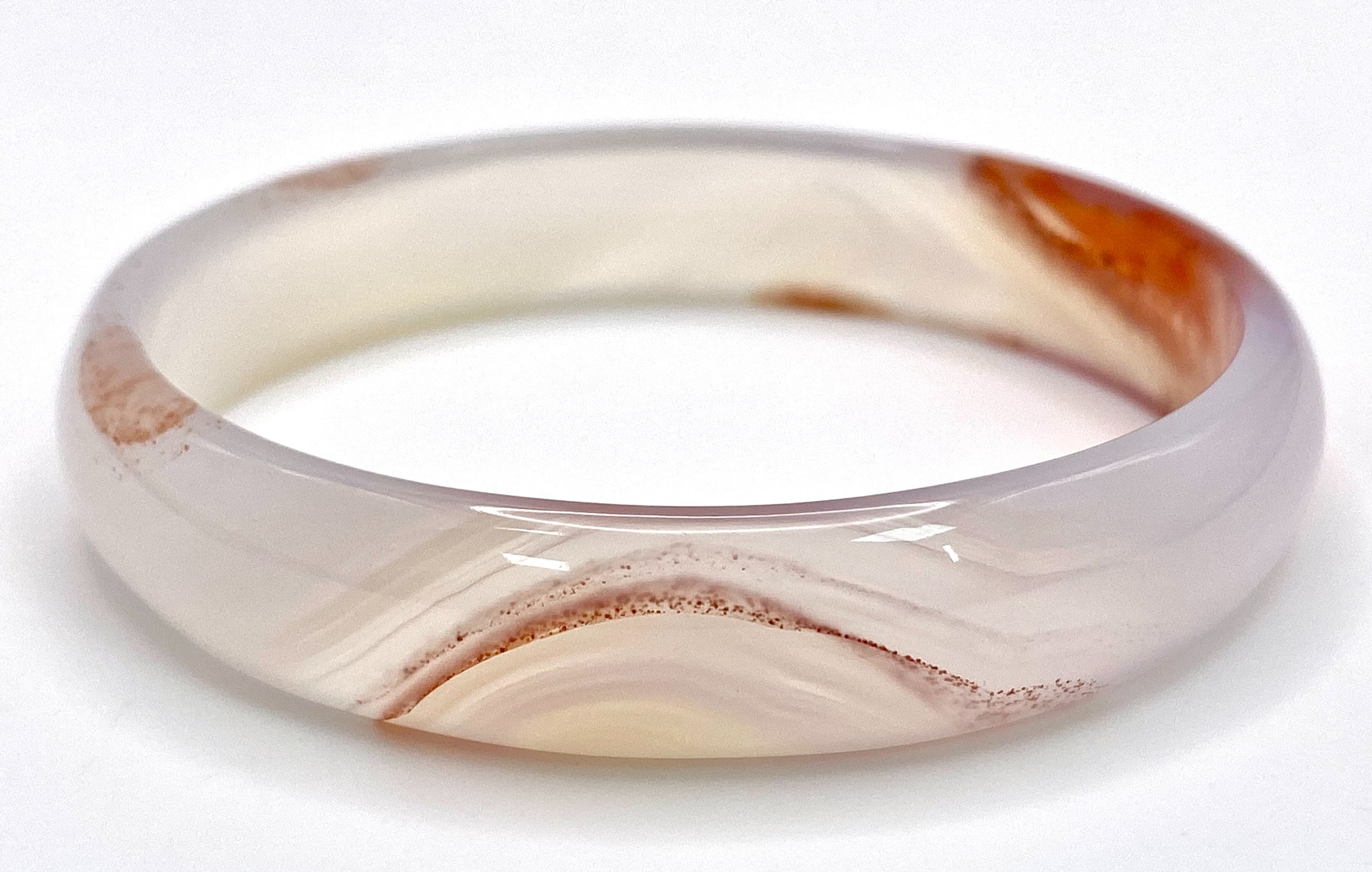 A White and Red Jade Bangle. 6cm inner diameter. - Image 3 of 3