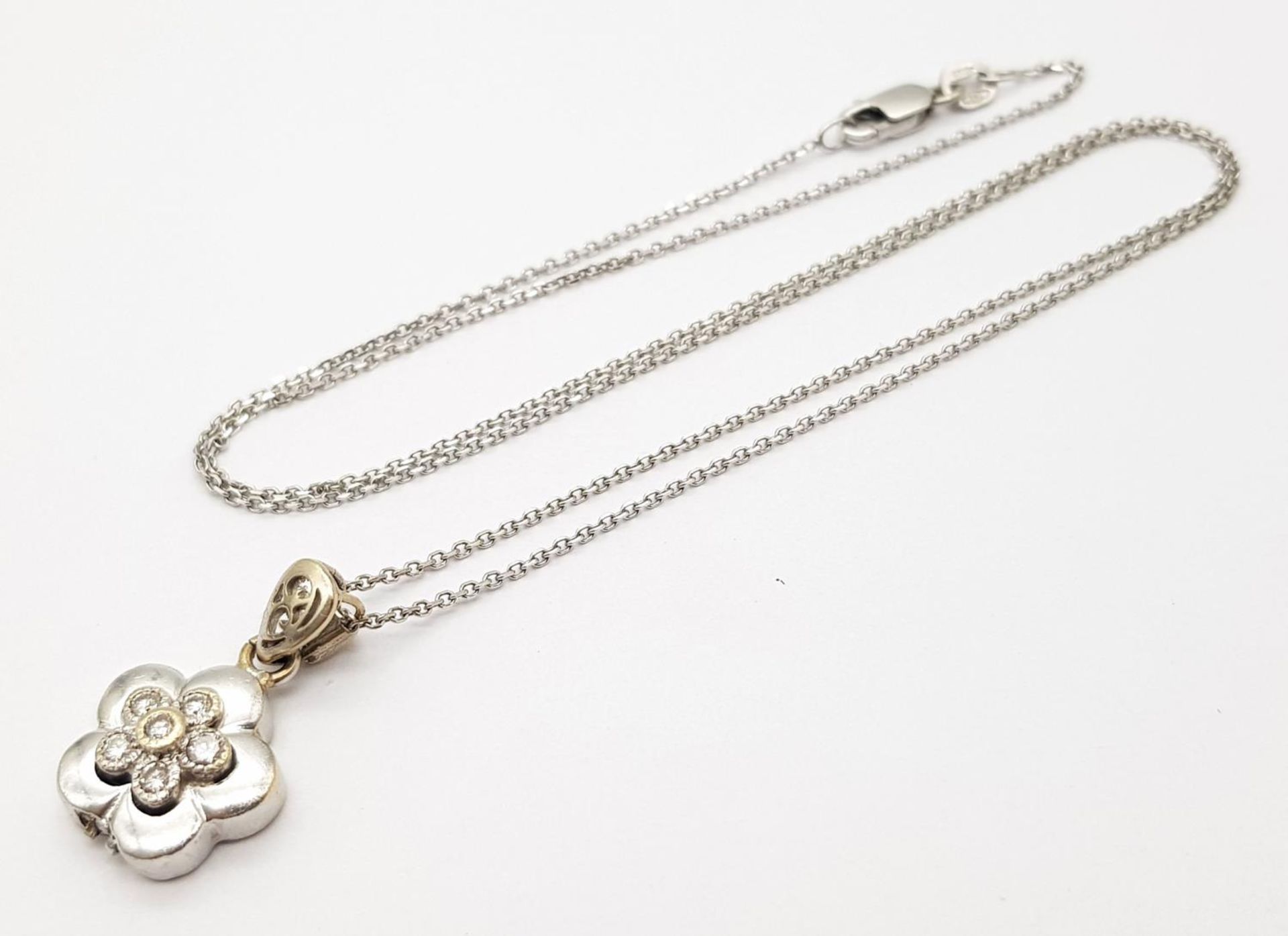 A 18ct White Gold Diamond Flower Necklace, 0.12ct diamond, 18” length, 12mm x 12mm pendant , 4.3g - Image 2 of 5
