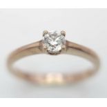 A 9K Rose Gold Diamond Solitaire Ring. 0.10ct round cut diamond. Size N. 2g total weight.