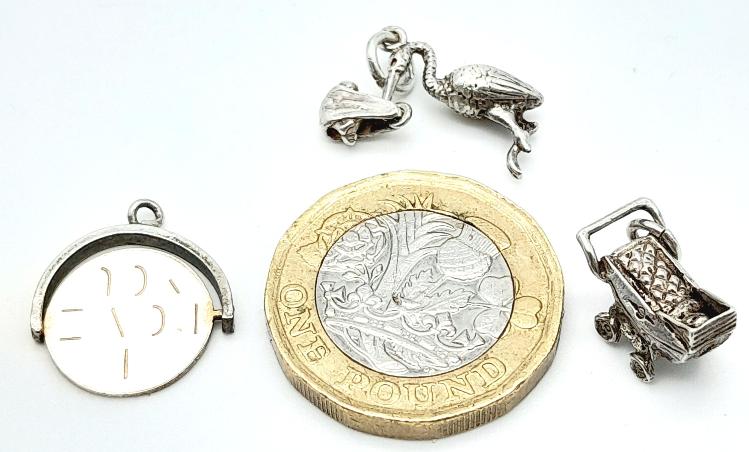 3 X STERLING SILVER NEW BABY THEMED CHARMS - PRAM, STALK CARRYING BABY, AND I LOVE YOU SPINNER. 4.4g - Image 3 of 3