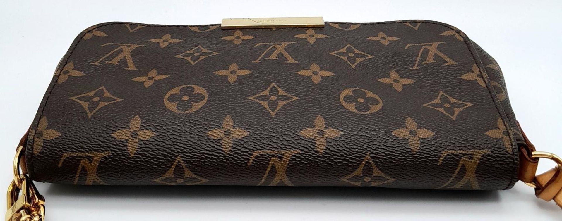 A Louis Vuitton Favourite PM Bag. Monogramed canvas exterior with gold-toned hardware, thin - Image 5 of 15