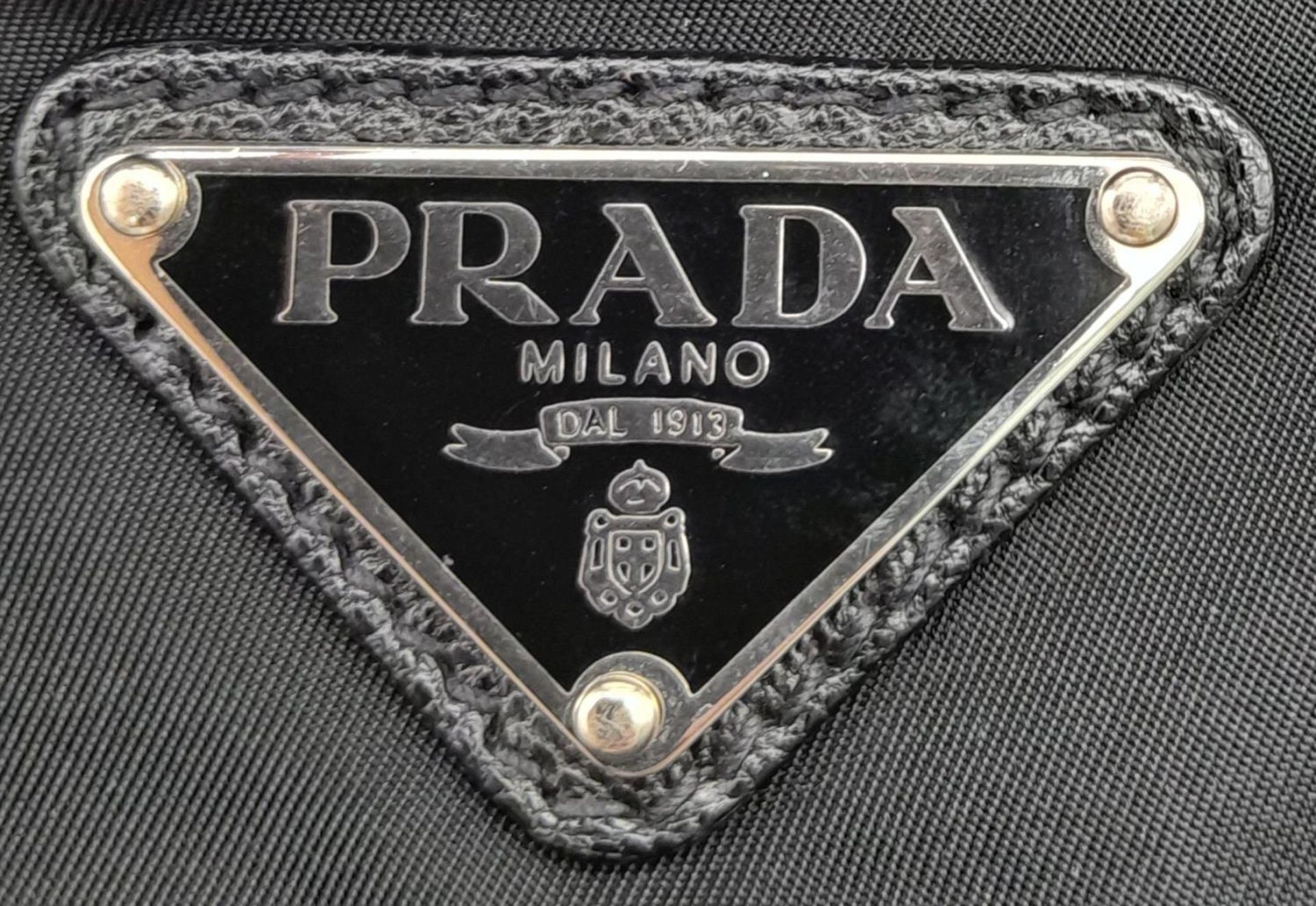 A Prada Black Compactable Tote Bag. Textile exterior with leather handles and zip top closure. Black - Bild 5 aus 12