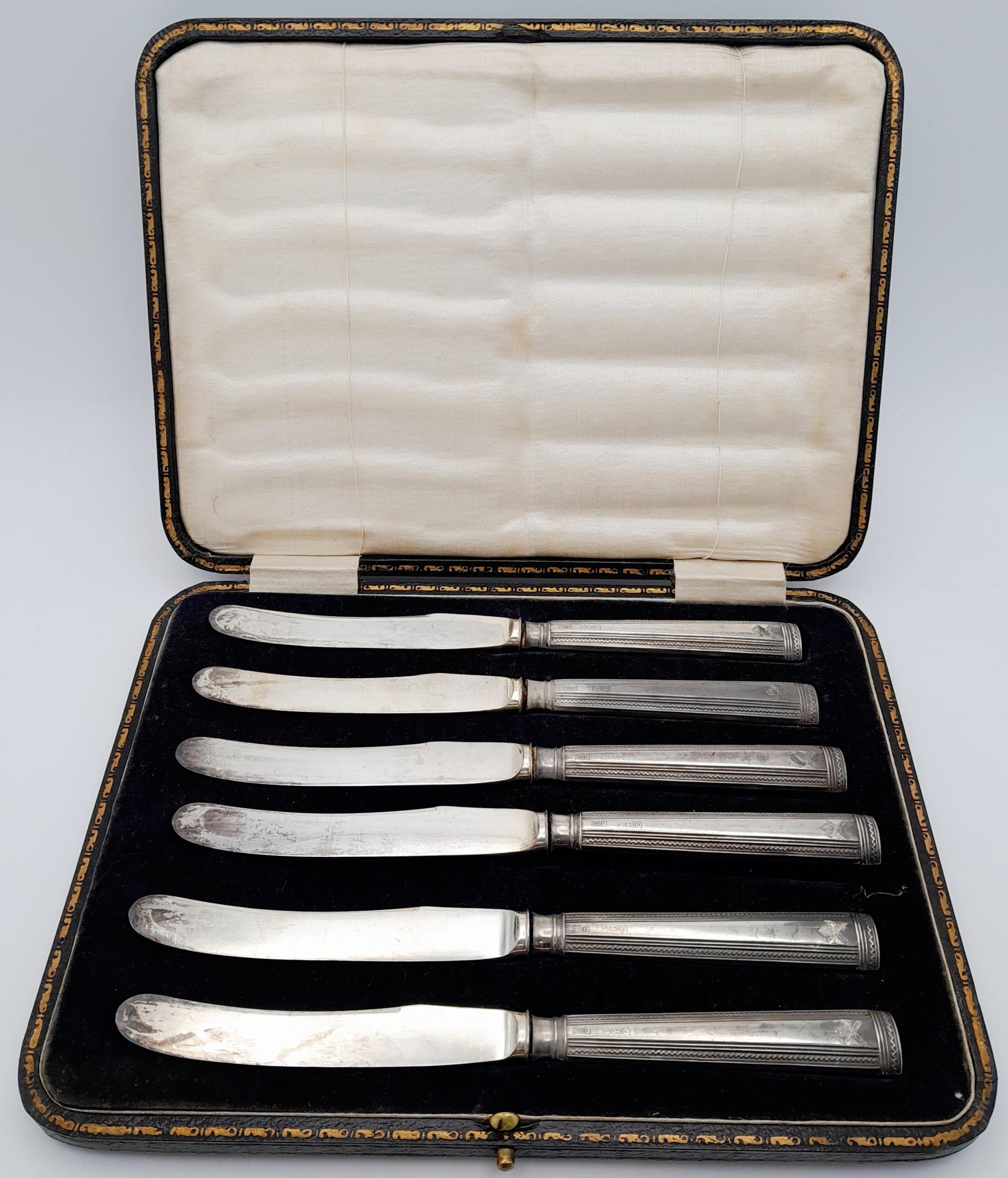 Set of 6 1917 Silver Hallmarked Butter Knives with the badge of the Machine Gun Corps.