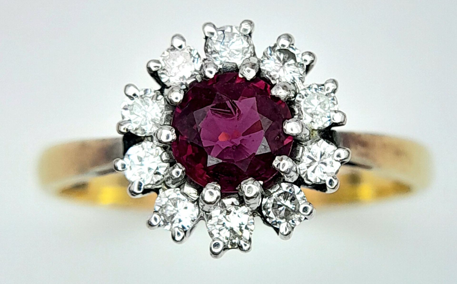 An 18K Yellow Gold, Ruby and Diamond Ring. Round cut ruby with a diamond halo. Size M 1/2. 2.8g - Image 3 of 8