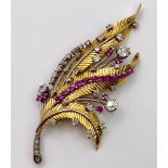 A Spectacular 18K Gold (tested) Diamond and Ruby Leaf Brooch. 3ctw of brilliant round cut diamonds