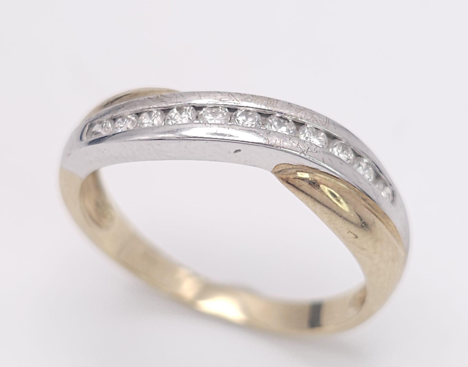 A 9K Yellow Gold and Diamond Half-Eternity Ring. 0.22ctw. 2.3g total weight. Size P.