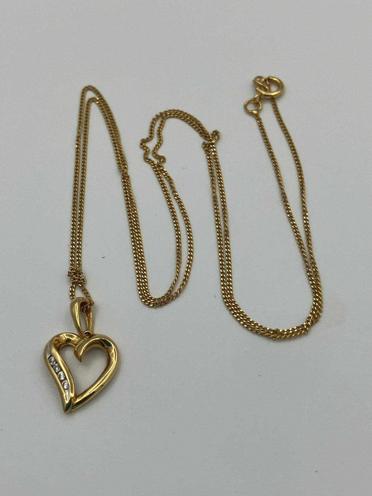 9 carat GOLD HEART PENDANT amounted on a 9 carat Fine GOLD CHAIN NECKLACE. 1.4 grams. Pendant 1.6 cm - Image 2 of 2